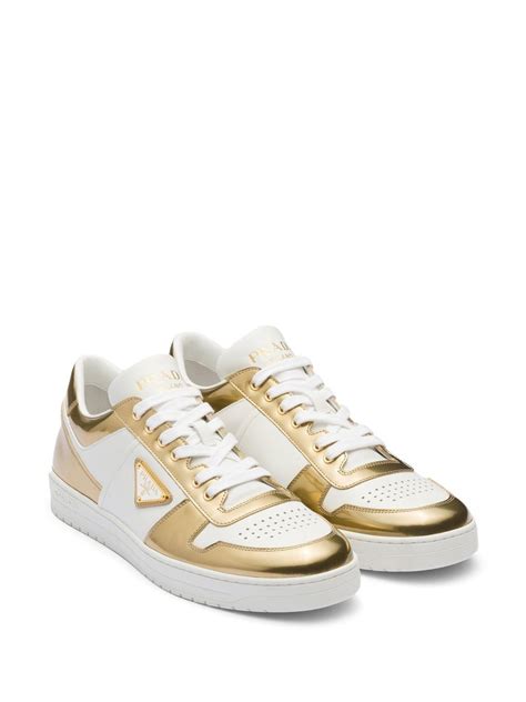 prada gold low top shoes.